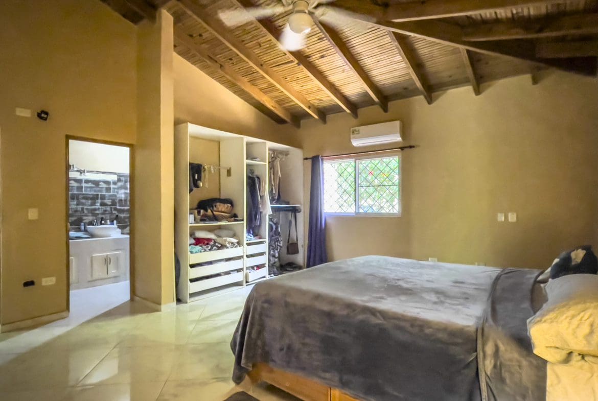 buyDRproperty Bedroom in a 3 bedroom villa for sale, featuring a wooden ceiling and walk-in closet. Sosua Real Estate