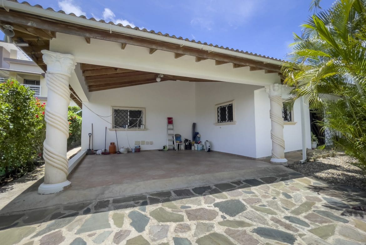 buyDRproperty For Sale 3 Bedroom Villa: Exterior view of a covered patio with stone flooring. Sosua Real Estate