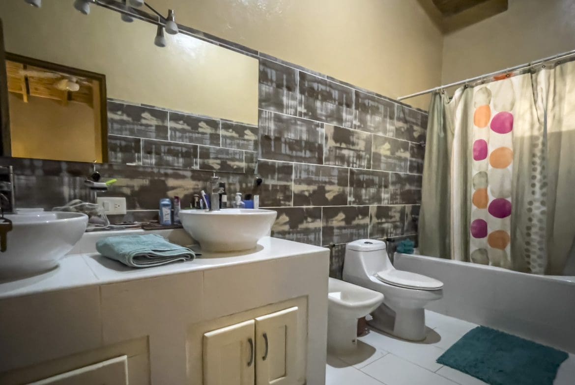 buyDRproperty Bathroom with vanity, toilet, and shower, part of a For Sale 3 Bedroom Villa. Sosua Real Estate