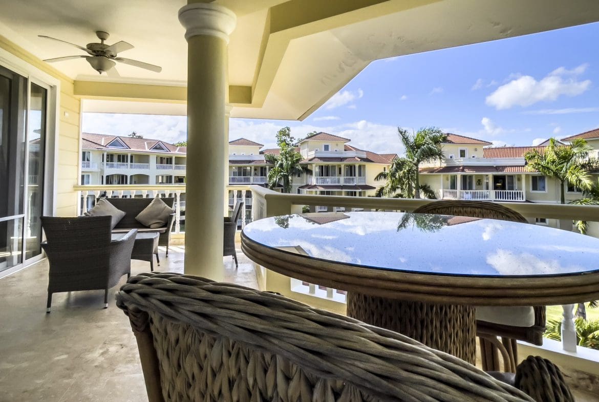buyDRproperty Stunning 3 Bedroom Condo balcony view of the ocean and resort buildings. Sosua Real Estate
