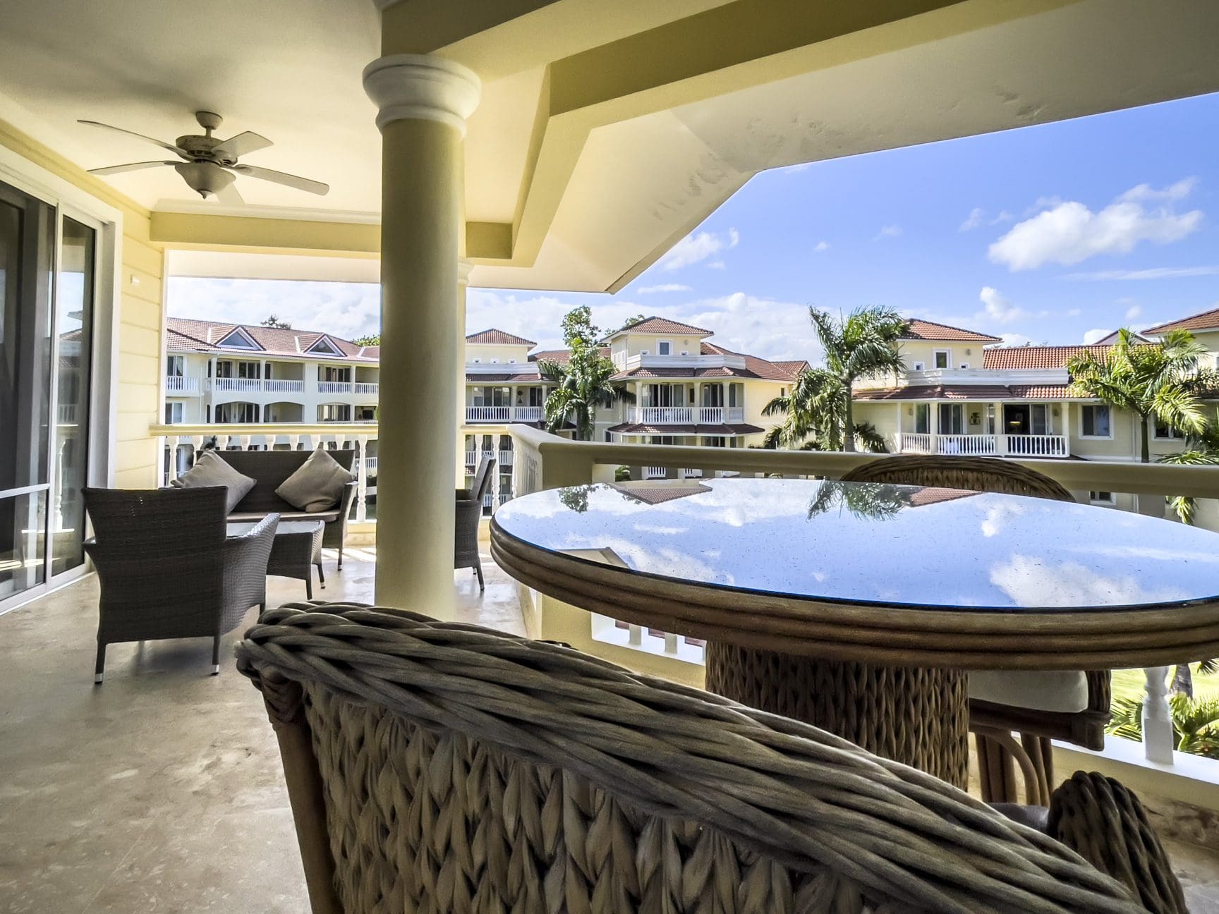buyDRproperty Stunning 3 Bedroom Condo balcony view of the ocean and resort buildings. Sosua Real Estate