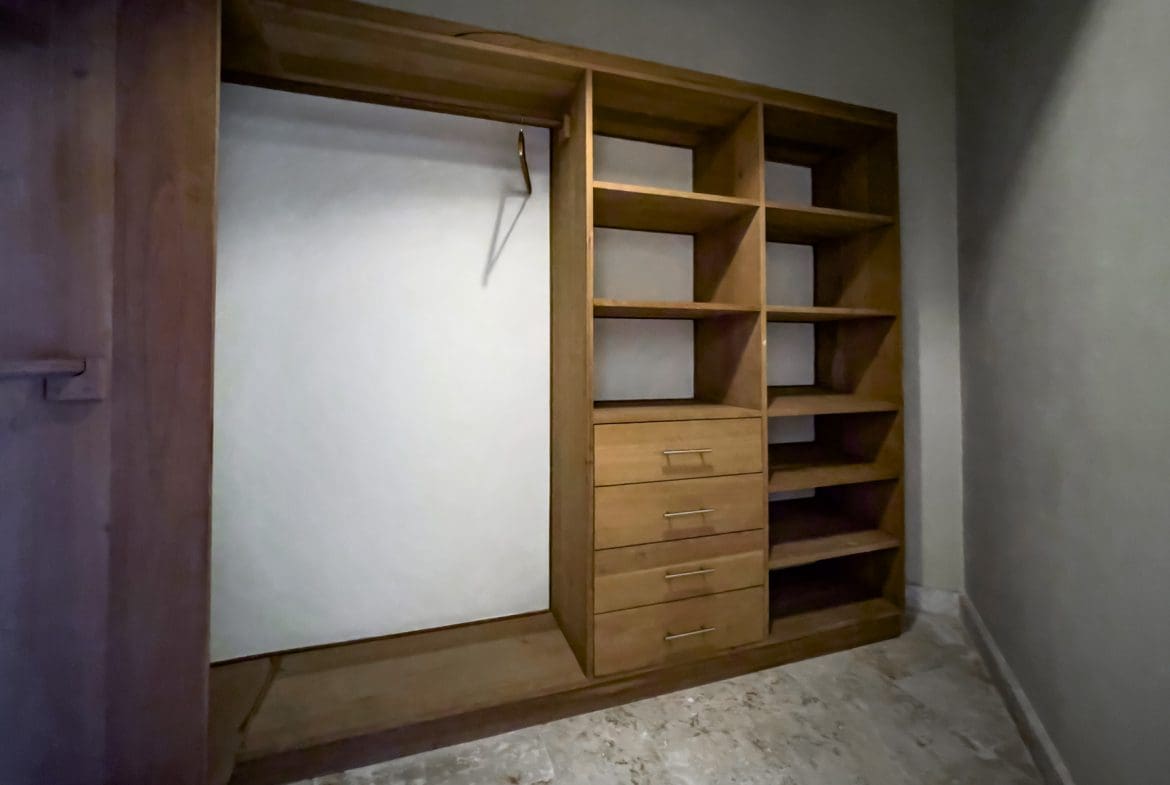 buyDRproperty Wooden closet with shelves and drawers in a stunning 3 bedroom condo Sosua Real Estate