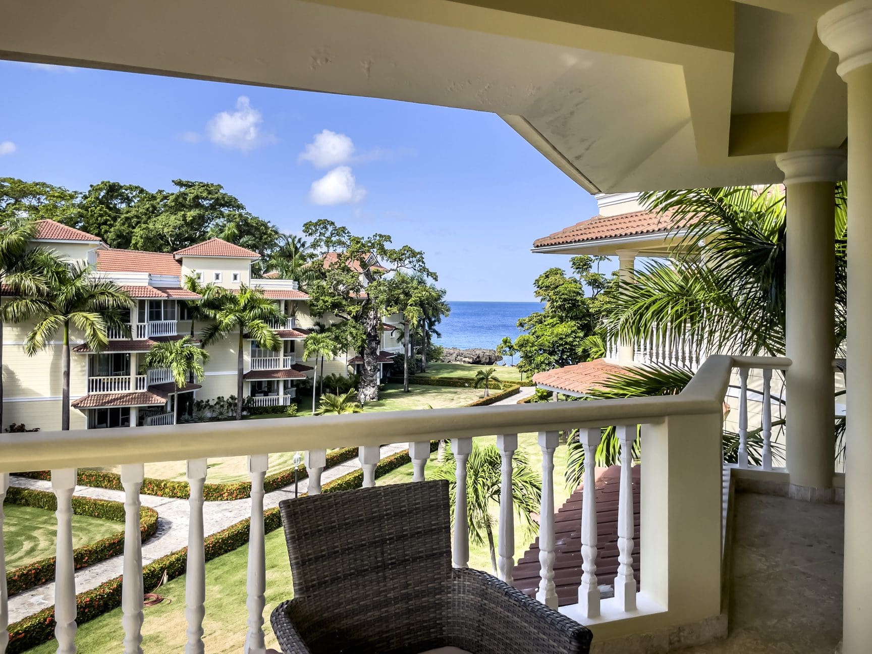 buyDRproperty Stunning 3-bedroom condo balcony overlooking the ocean and lush green grounds. Sosua Real Estate