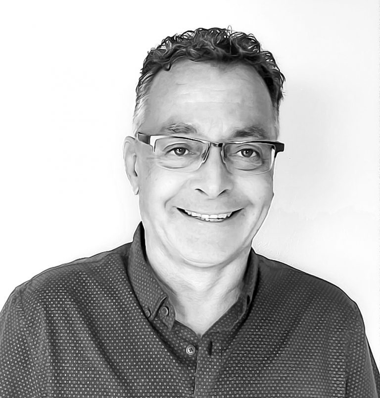 PietBWGreyscale  buyDRpropertycom Buydrproperty Man Smiling with Glasses Showing Teeth Cosmetic Dentistry Can Improve Your Smile Sosua Real Estate Buydrpropertycom Buydrpropertycom