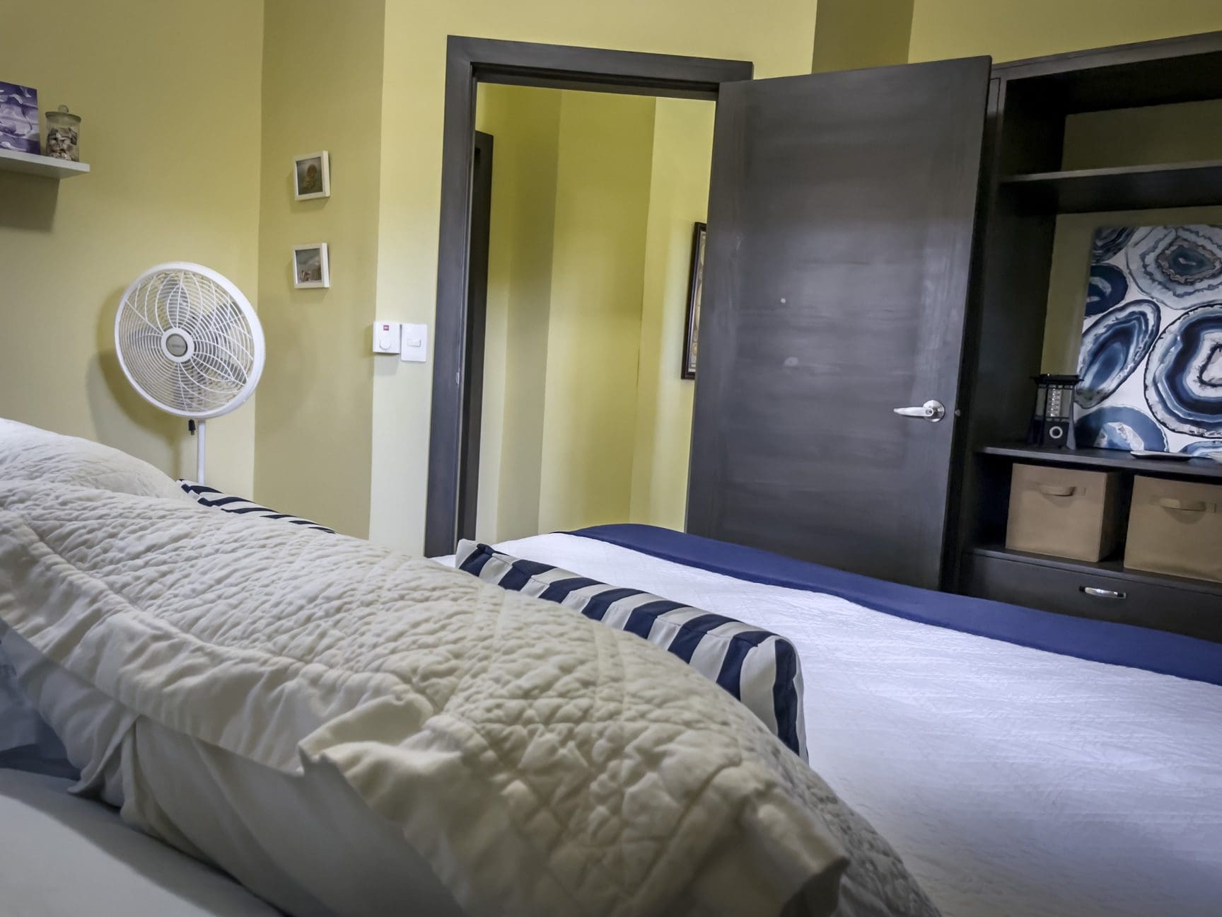 buyDRproperty Bedroom interior of a stunning 2 bedroom villa with bed, fan, and closet. Sosua Real Estate