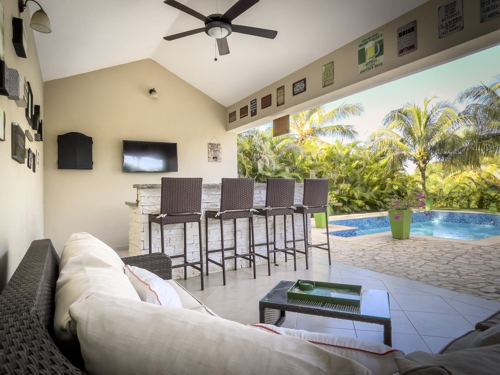 buyDRproperty Outdoor bar area with pool view at a stunning 2 bedroom villa Sosua Real Estate