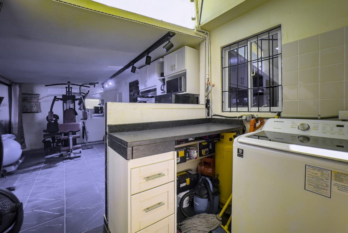 buyDRproperty Laundry room with Samsung washing machine, part of a smart home for sale. Sosua Real Estate