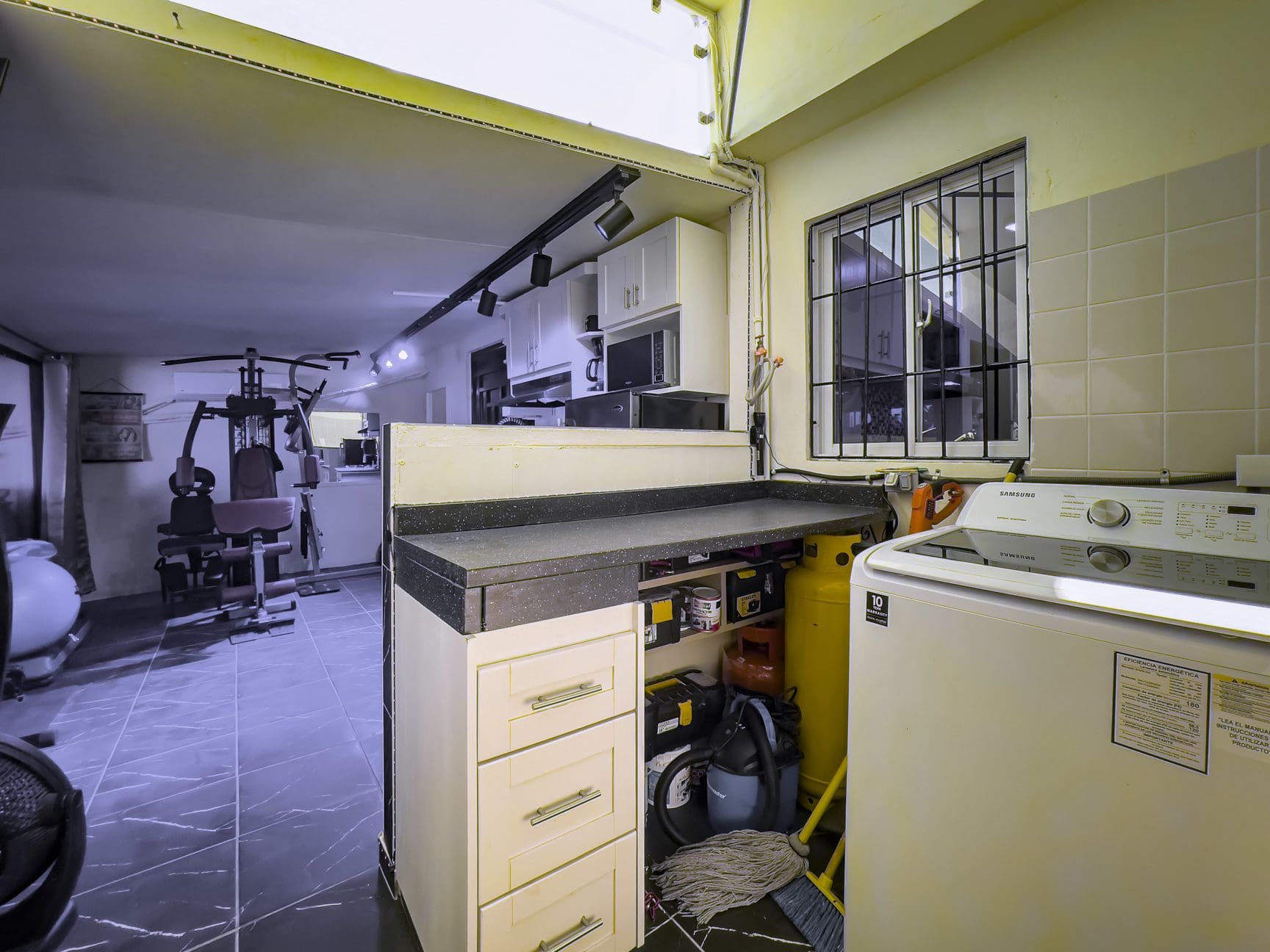 buyDRproperty Laundry room with Samsung washing machine, part of a smart home for sale. Sosua Real Estate
