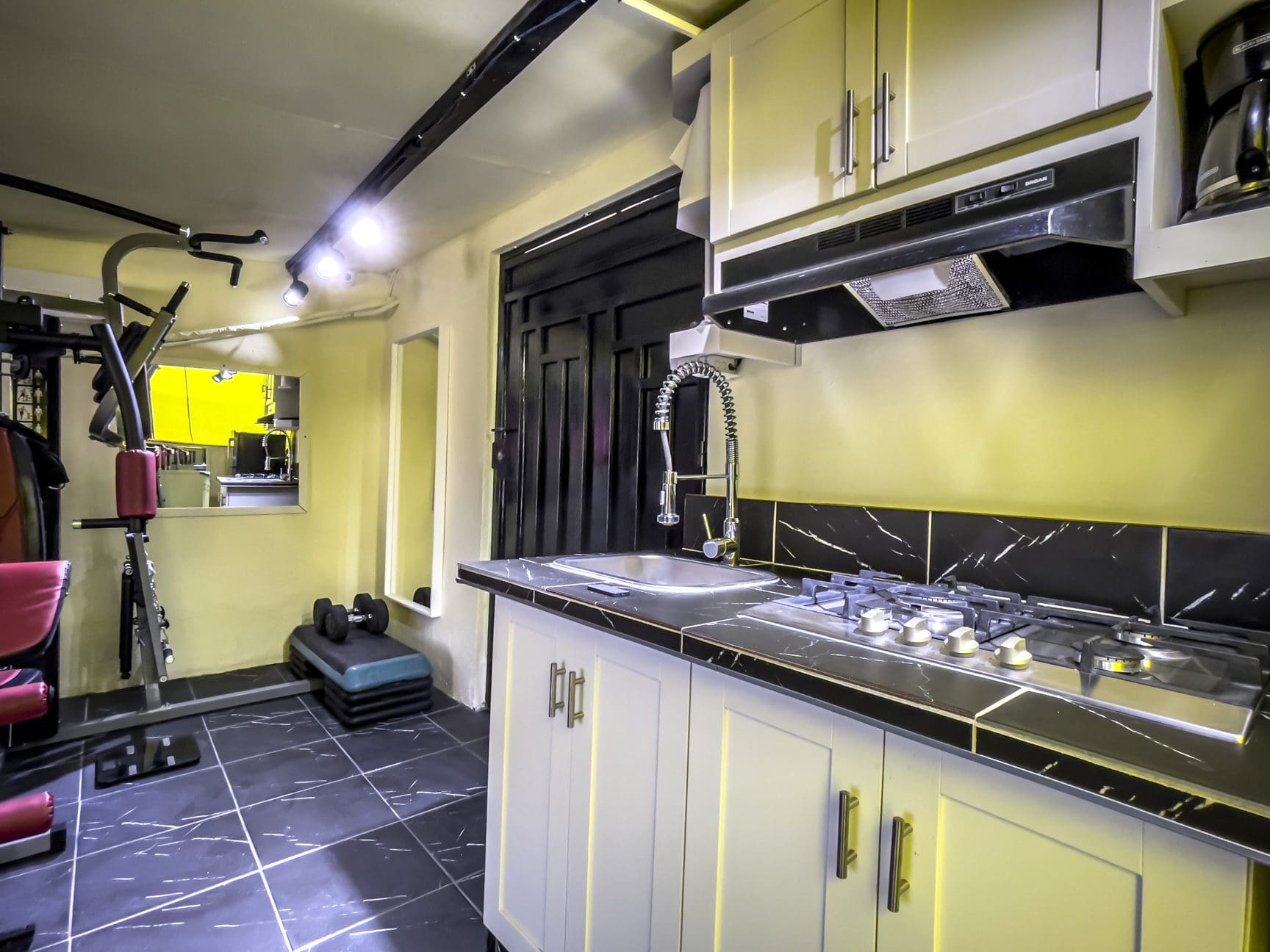 buyDRproperty Kitchen in a Smart Home For Sale! with stove, sink, and cabinets. Sosua Real Estate