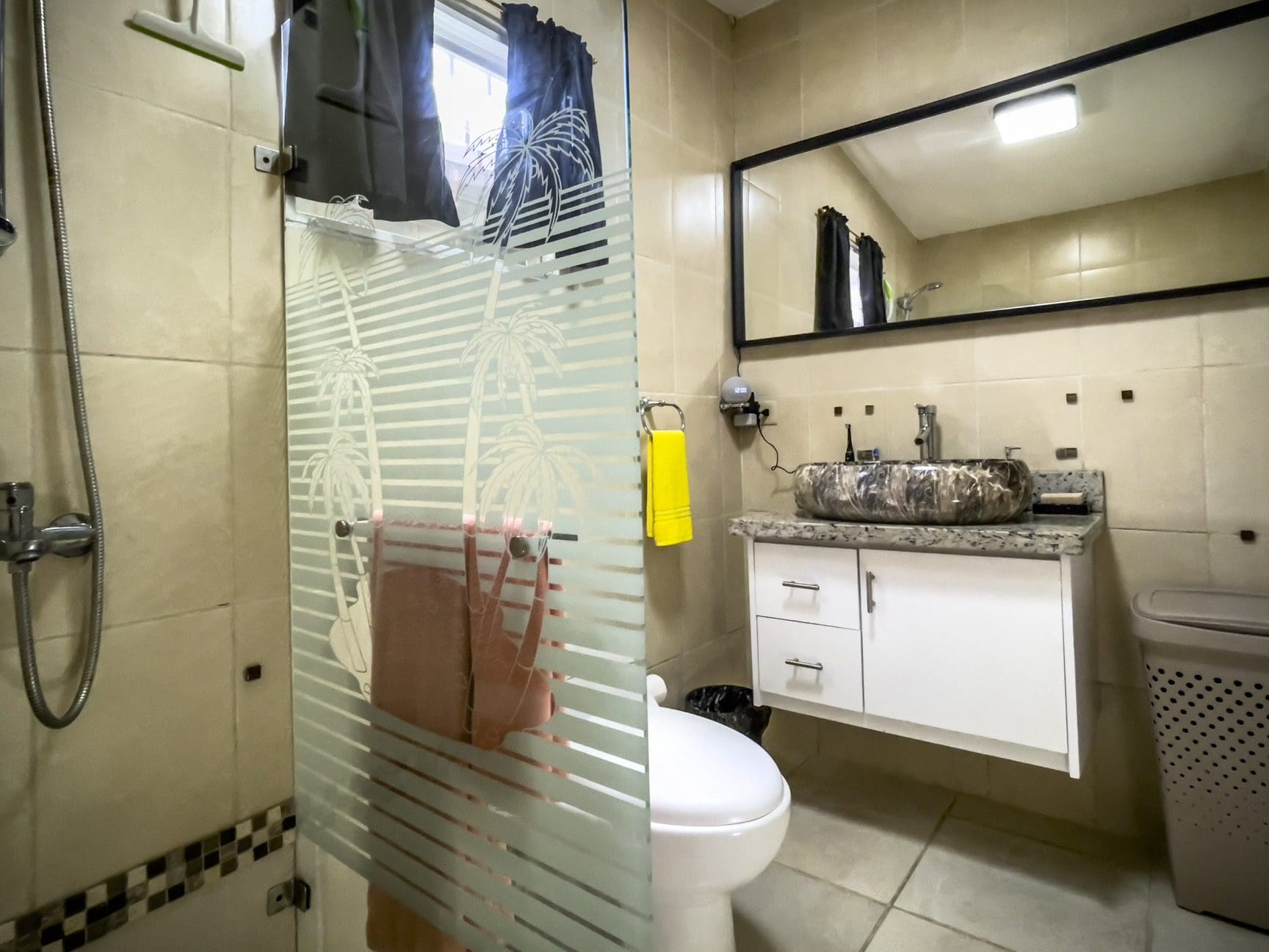 buyDRproperty Bathroom in a smart home for sale with a patterned glass shower door and a unique sink. Sosua Real Estate