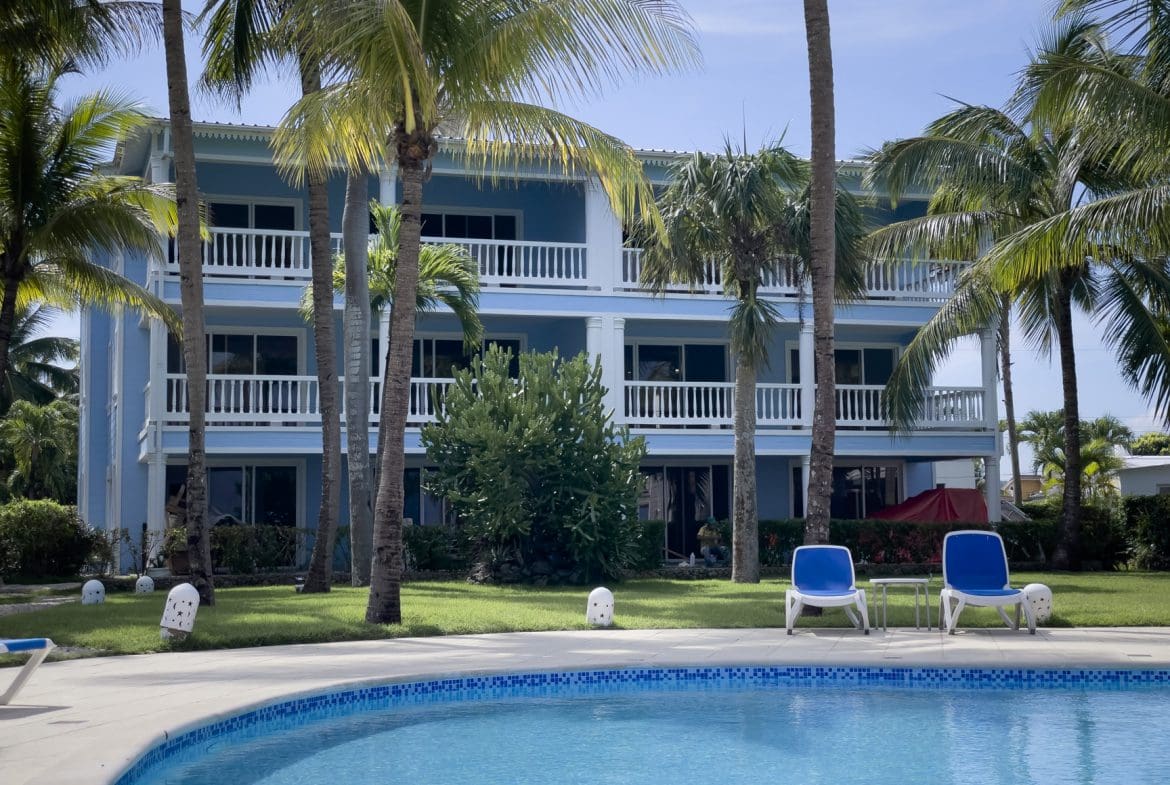 buyDRproperty Oceanfront 2 bedroom condos with pool and palm trees Sosua Real Estate