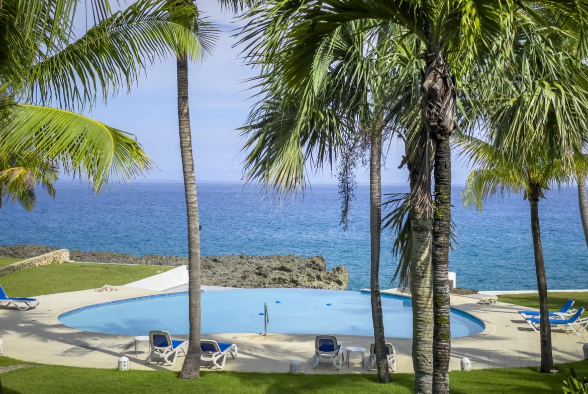 buyDRproperty Oceanfront view from a pool at 2 bedroom condos for sale. Sosua Real Estate