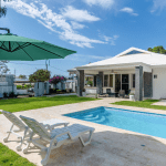 Buydrproperty Gorgeous 5 Bedroom Villa with a Pool and Lounge Chairs on a Sunny Day Sosua Real Estate Buydrpropertycom Buydrpropertycom