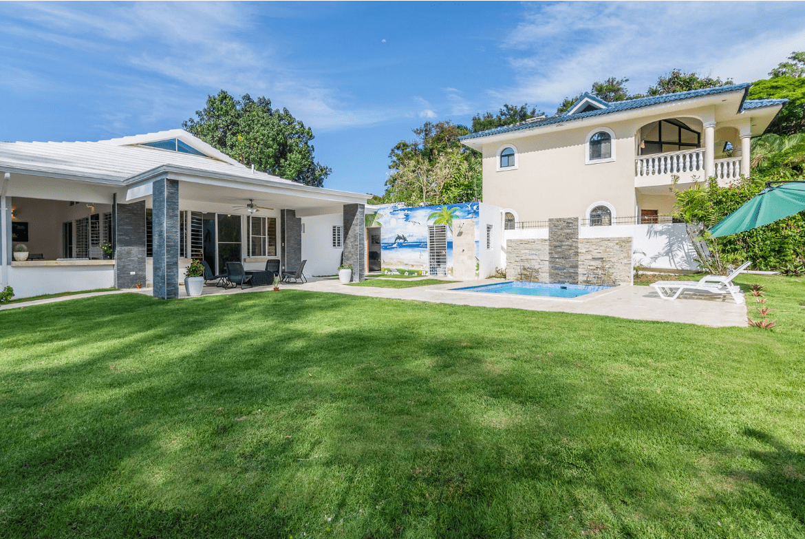 buyDRproperty Gorgeous 5 Bedroom Villa with pool and lush green lawn. Sosua Real Estate