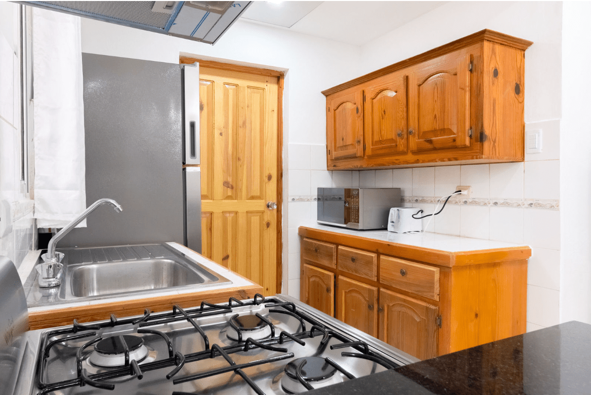 buyDRproperty Kitchen with stainless steel appliances in a gorgeous 5 bedroom villa. Sosua Real Estate