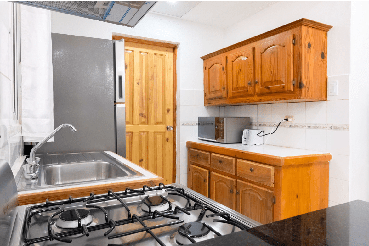 buyDRproperty Kitchen with stainless steel appliances in a gorgeous 5 bedroom villa. Sosua Real Estate