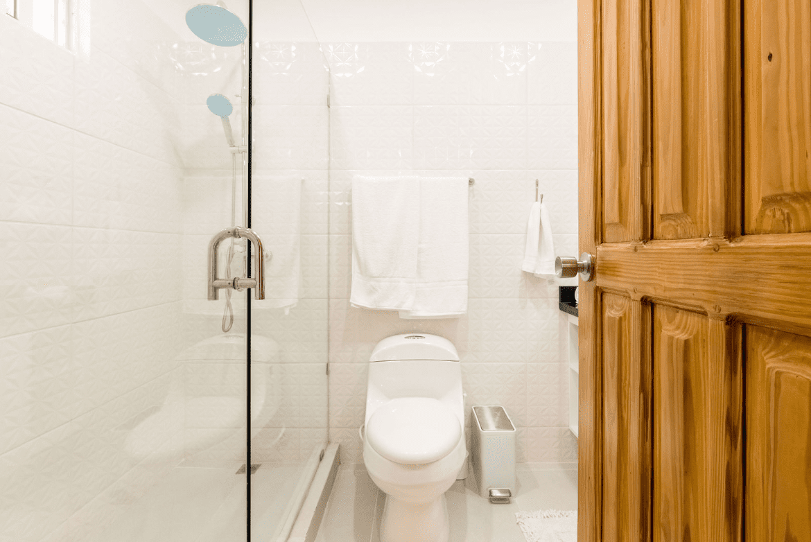 buyDRproperty Modern bathroom in a gorgeous 5 bedroom villa with a glass shower and white tile. Sosua Real Estate