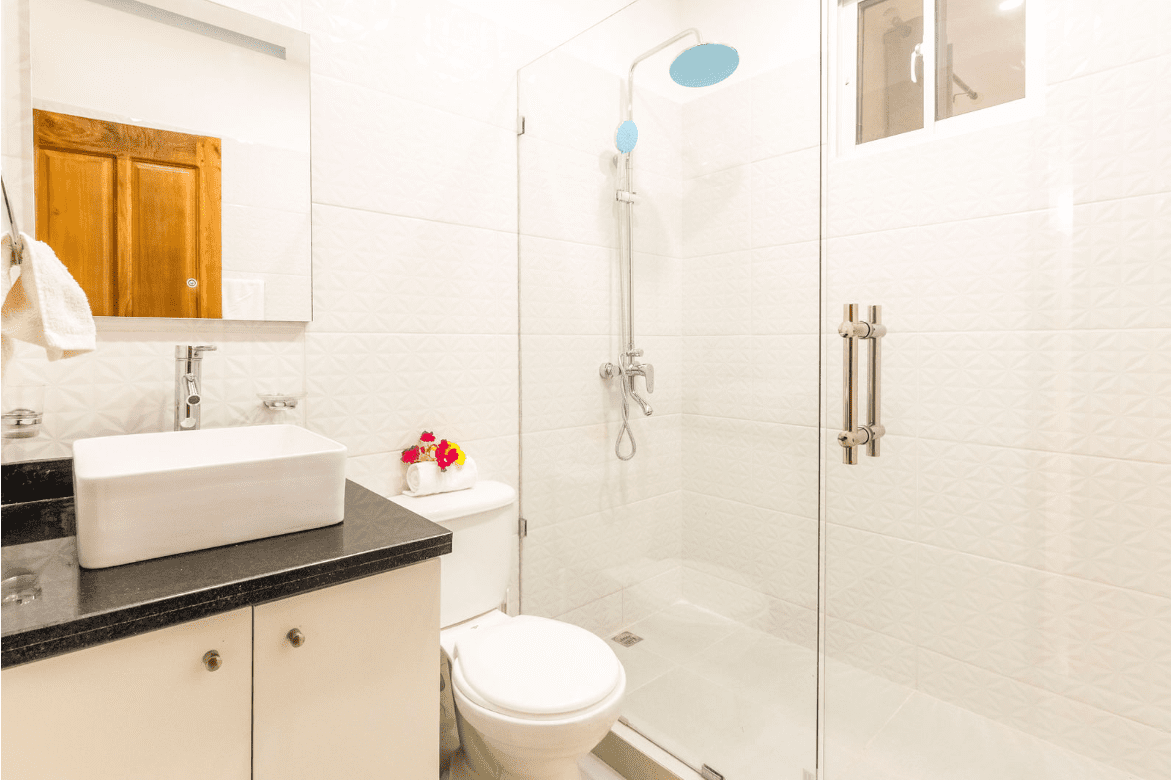 buyDRproperty Modern bathroom with a shower, toilet, and sink in a gorgeous 5 bedroom villa. Sosua Real Estate