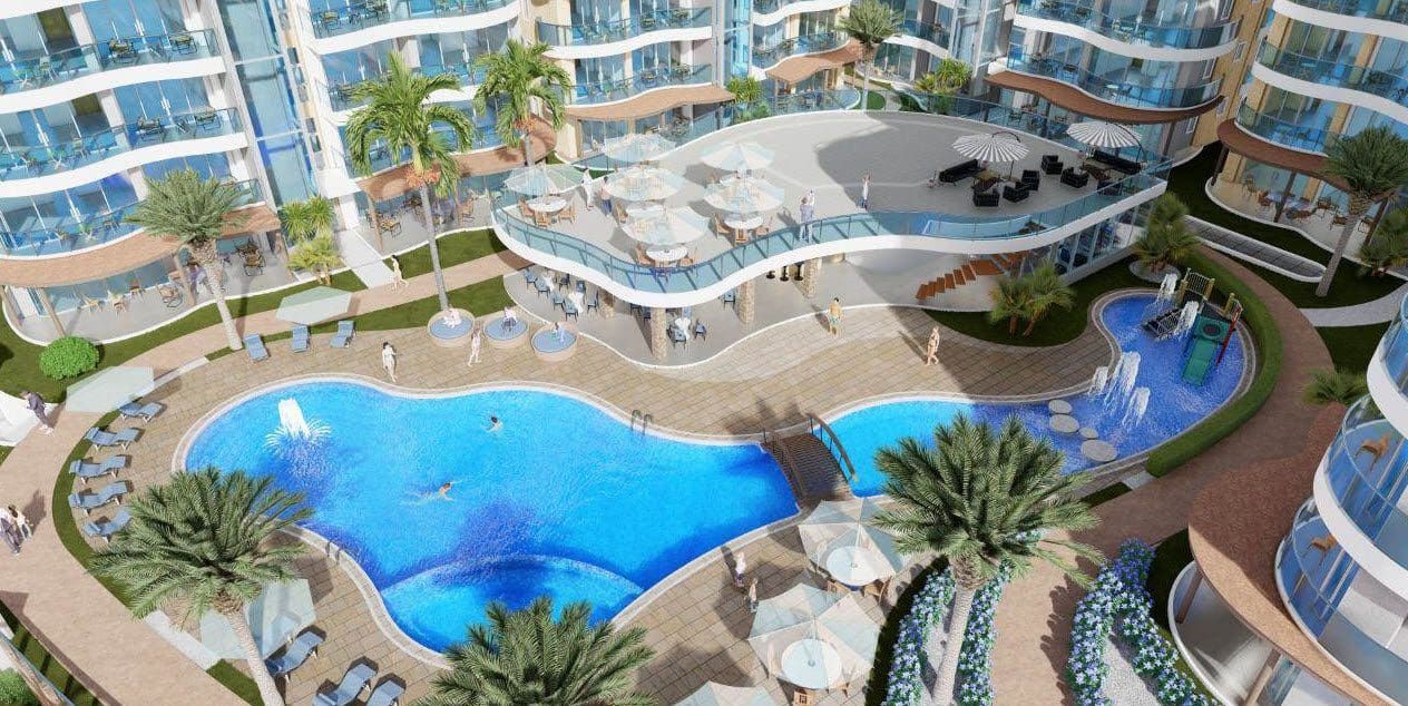 buyDRproperty Luxury Atlantic Luxury Towers resort in the Dominican Republic with pool and dining area. Sosua Real Estate