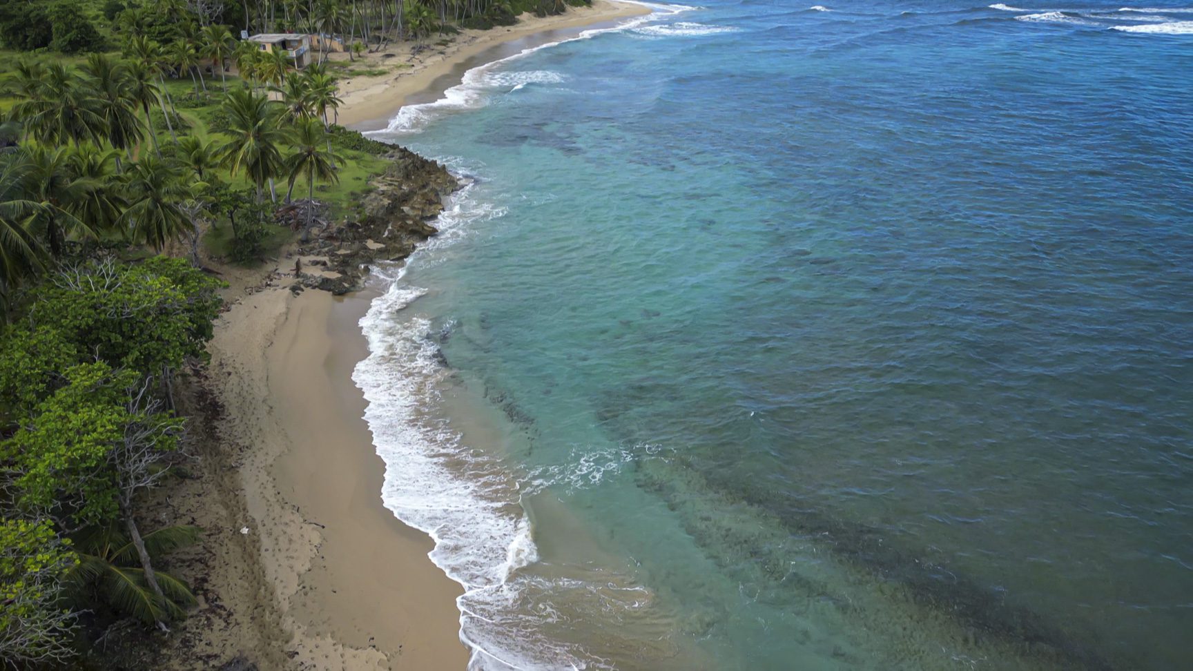 buyDRproperty Stunning oceanfront development property with turquoise water and sandy beach. Sosua Real Estate