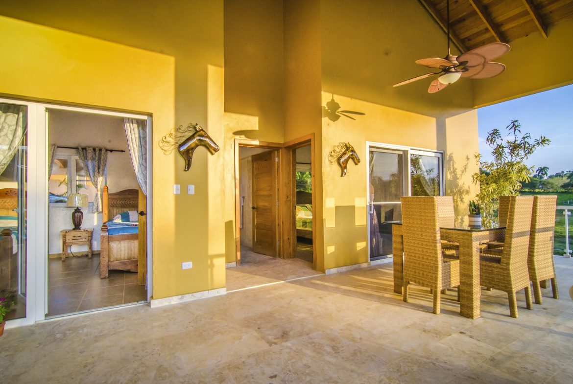 buyDRproperty Covered patio of a Villa For Sale in the Community of Terramar with dining area and bedroom view. Sosua Real Estate