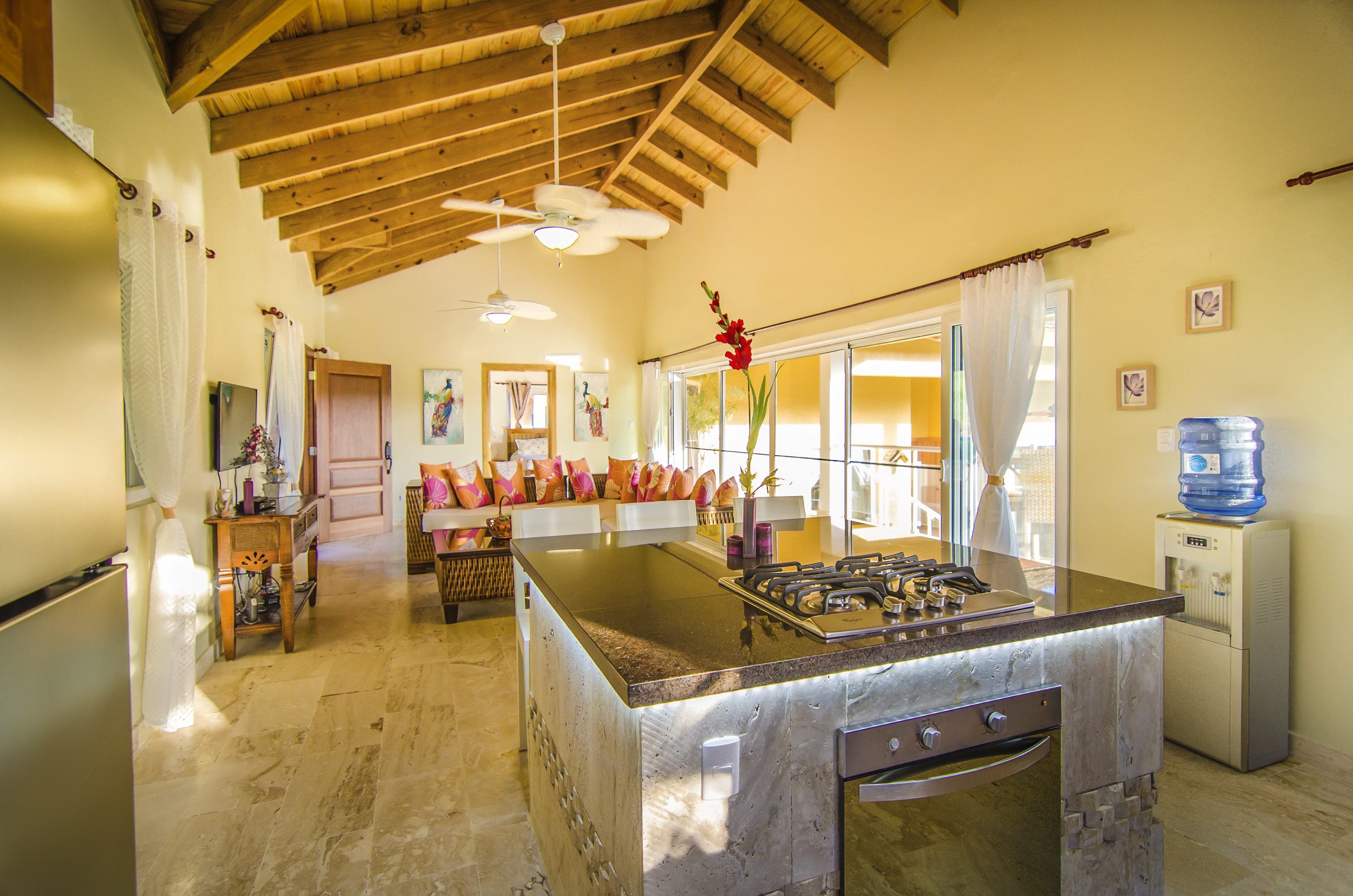 buyDRproperty Bright kitchen in a Villa For Sale in the Community of Terramar, featuring a gas cooktop and island. Sosua Real Estate