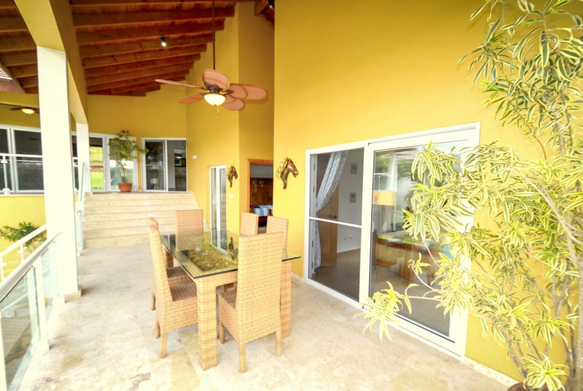 buyDRproperty Patio dining area of a Villa For Sale in the Community of Terramar. Sosua Real Estate