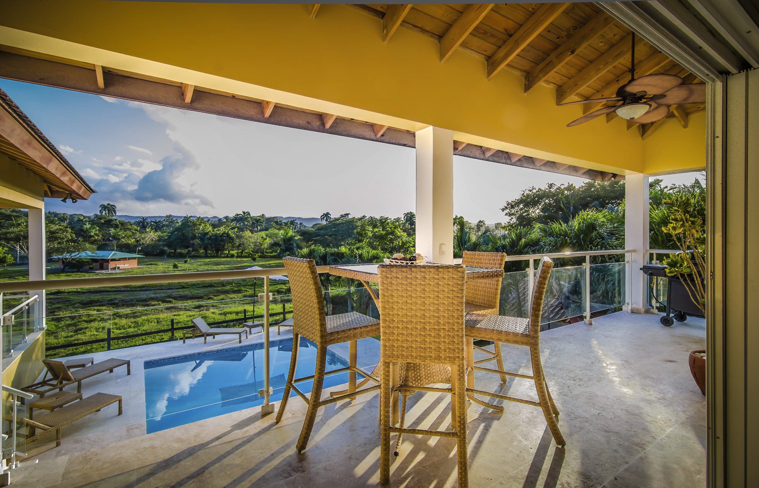 buyDRproperty Patio of a Villa For Sale in the Community of Terramar, with a pool and scenic view. Sosua Real Estate