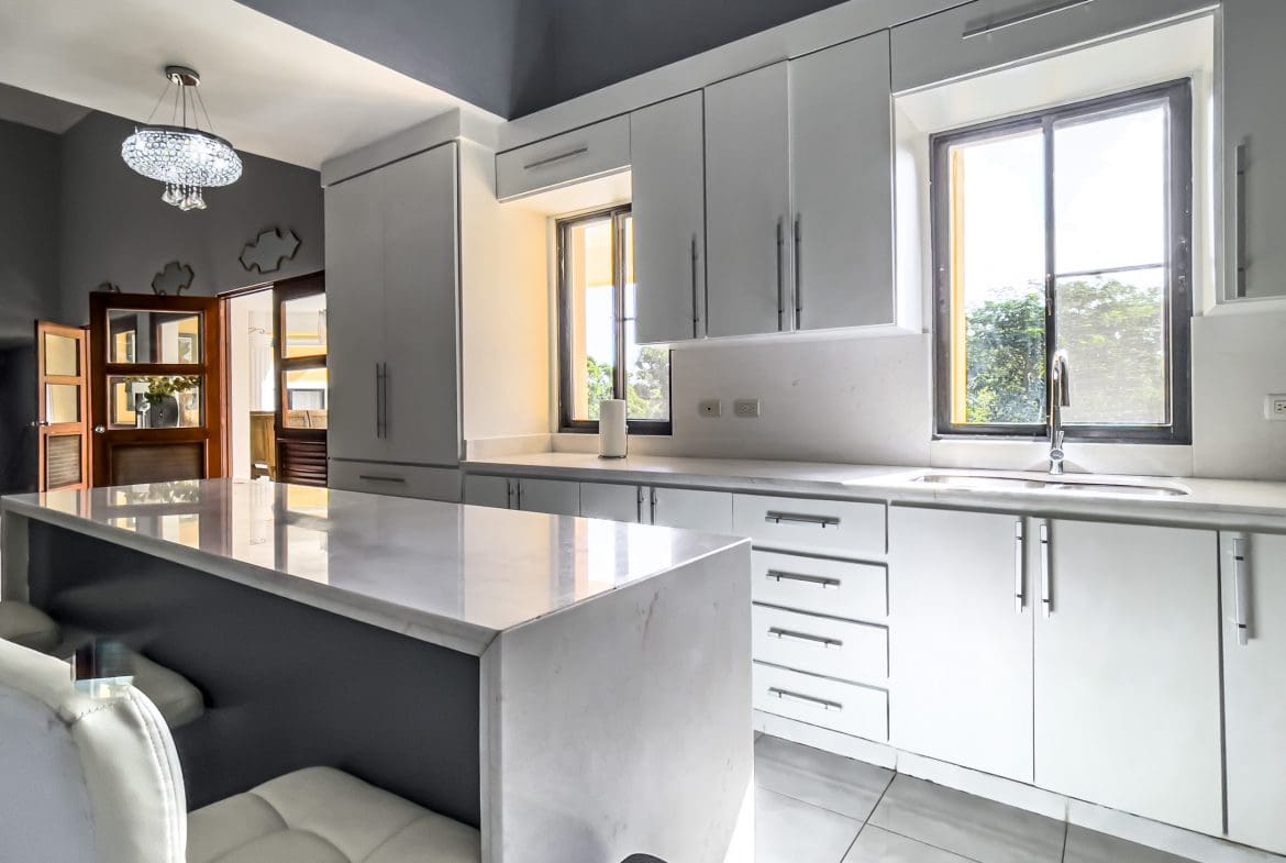 buyDRproperty Modern white kitchen in a stunning 4 bedroom villa with marble countertops. Sosua Real Estate