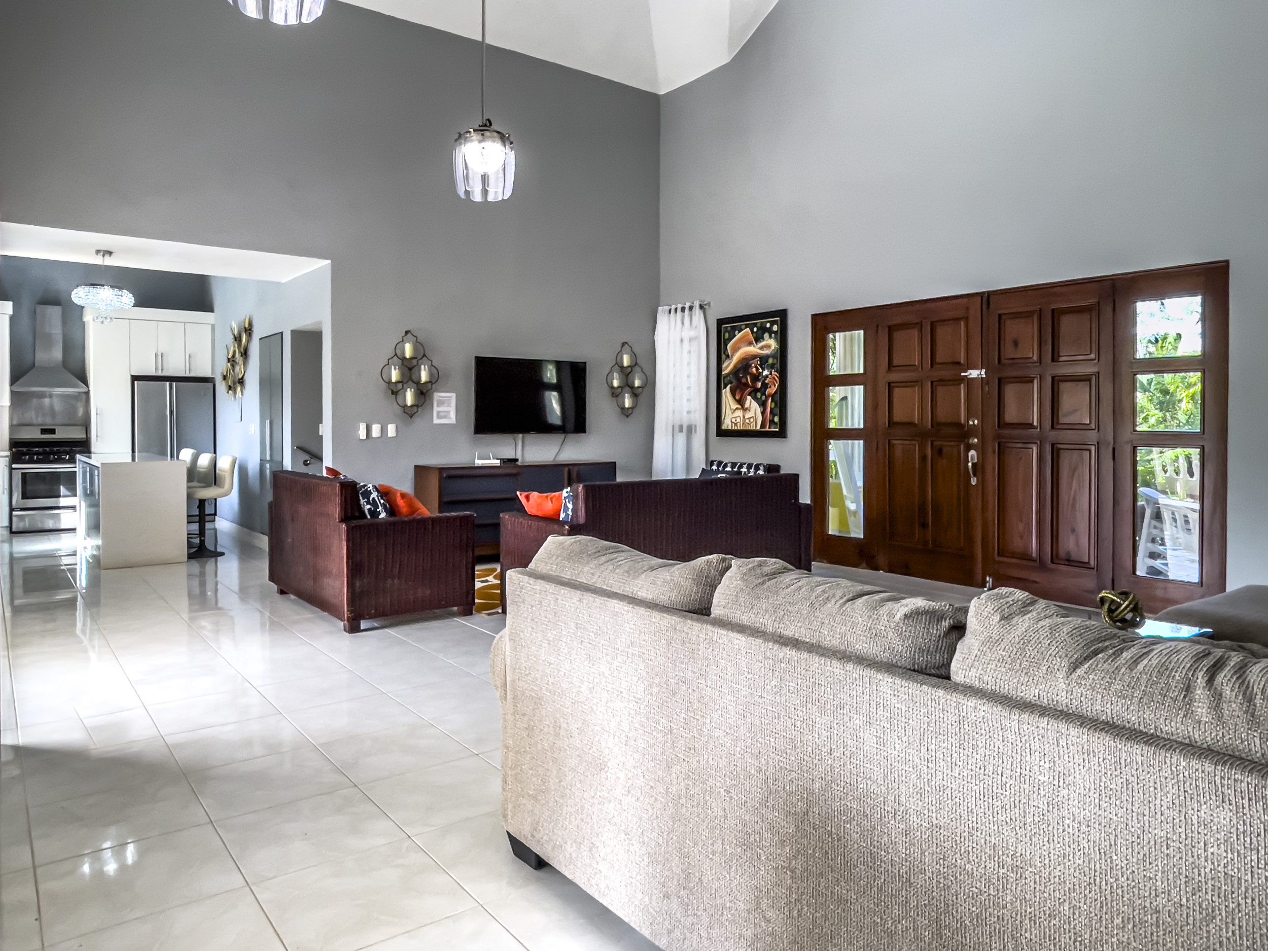 buyDRproperty Spacious living room in a stunning 4 bedroom villa with high ceilings and tile floors. Sosua Real Estate