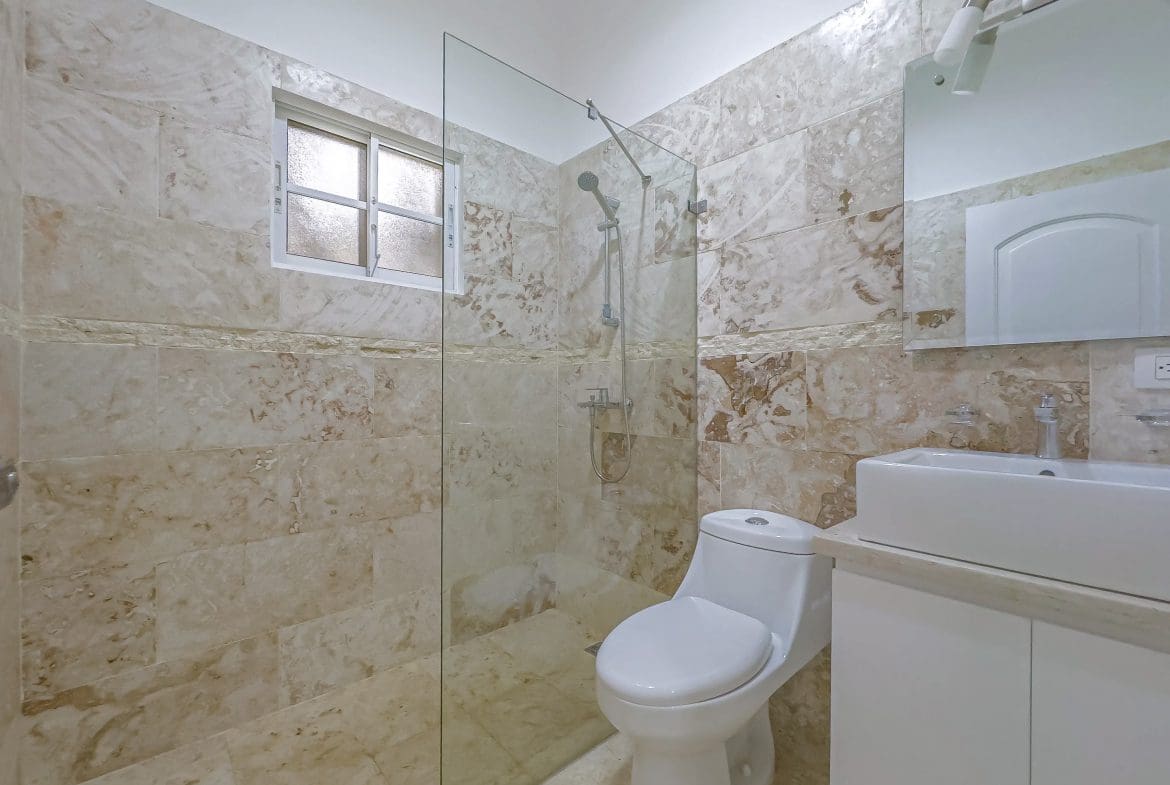 buyDRproperty Bathroom with beige tile, shower, and Renovated Villa CAOBA Sosua Real Estate