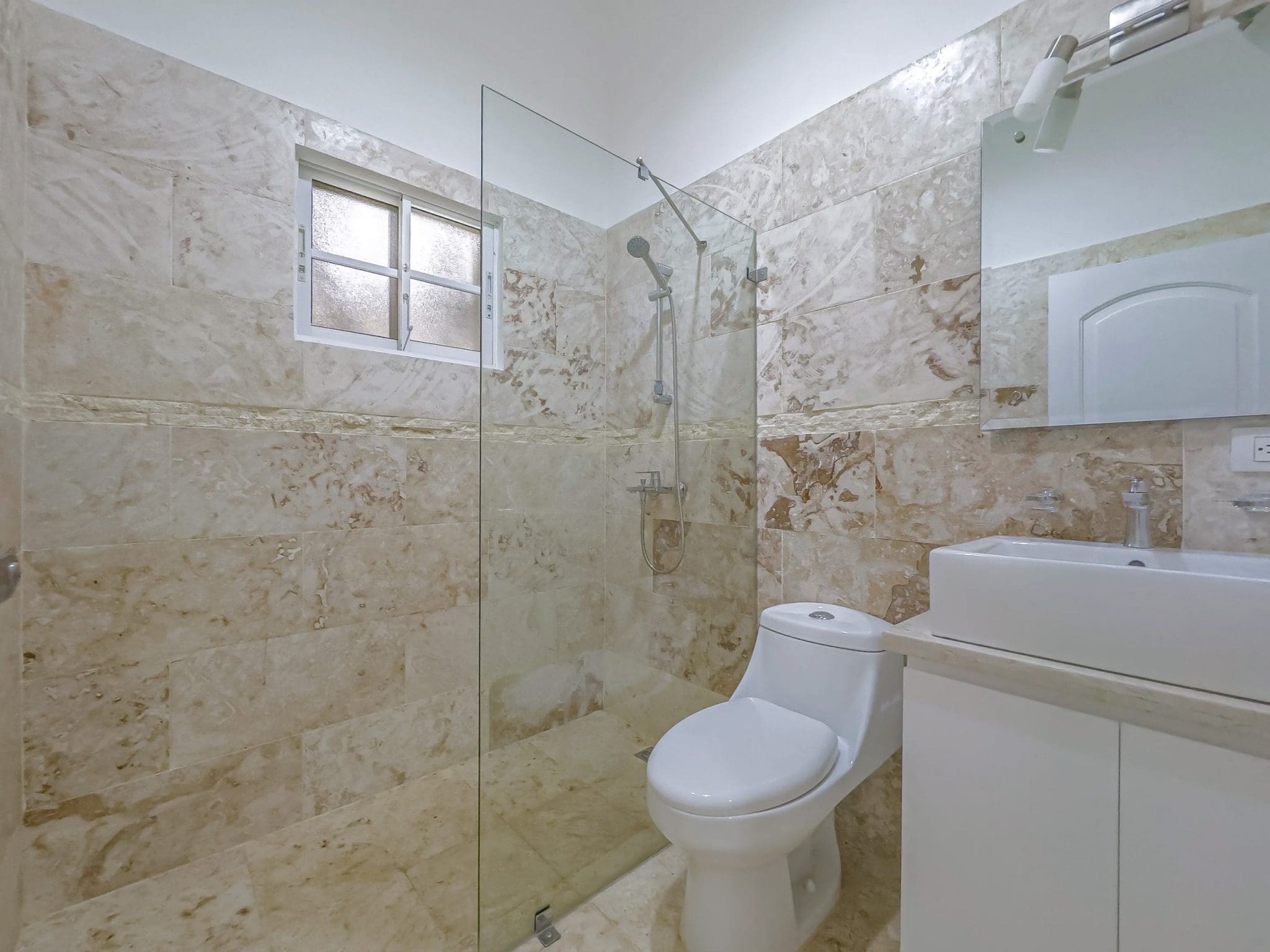 buyDRproperty Bathroom with beige tile, shower, and Renovated Villa CAOBA Sosua Real Estate