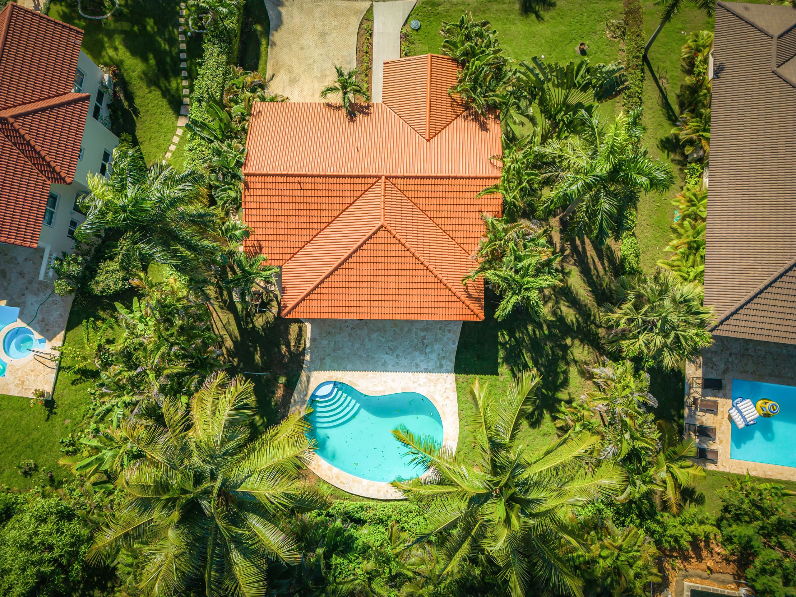 buyDRproperty Aerial view of Renovated Villa CAOBA with pool in lush Residencial Hispaniola Sosua Real Estate