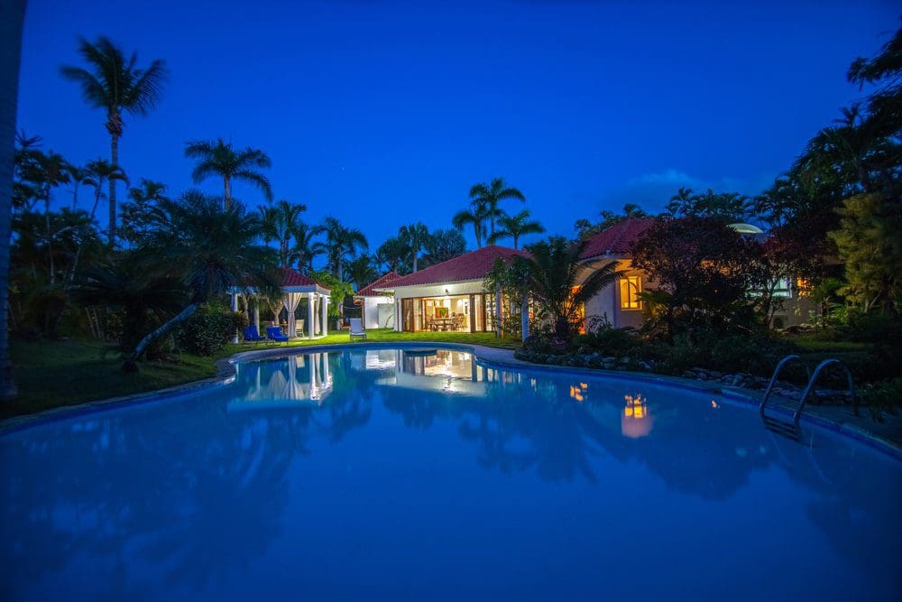 buyDRproperty Villa LUNA oceanfront property with pool at dusk in Sea Horse Ranch Sosua Real Estate