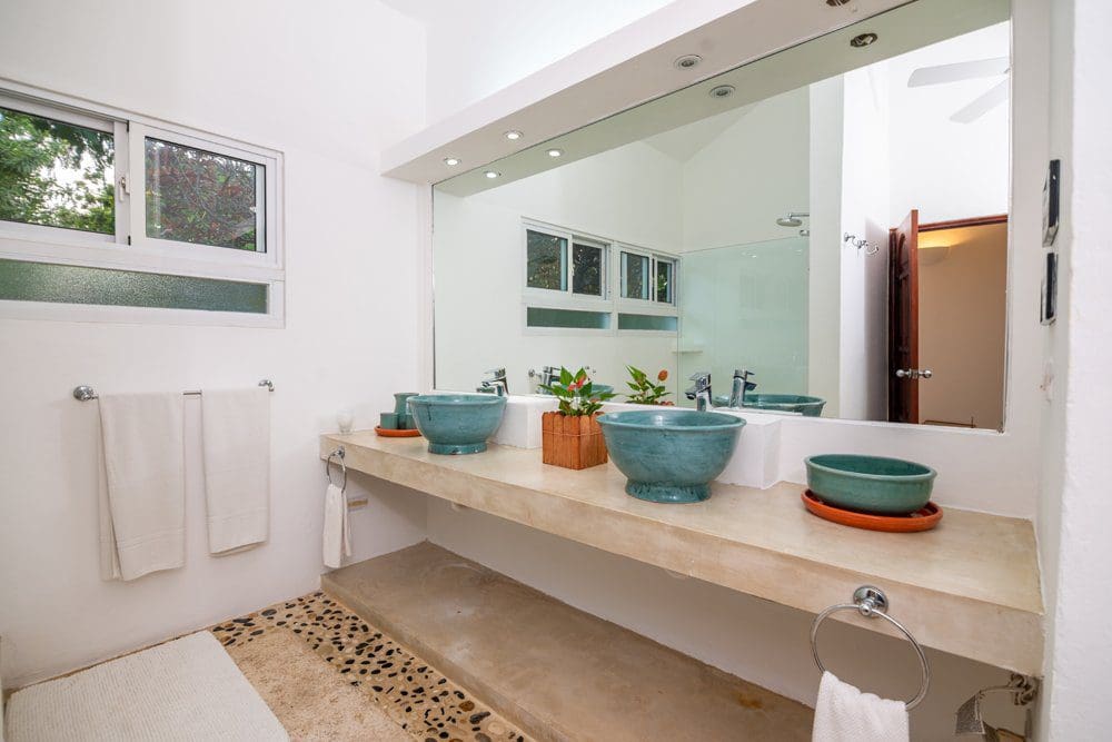 buyDRproperty Modern villa bathroom with turquoise sinks, part of a Sea Horse Ranch villa luna property. Sosua Real Estate