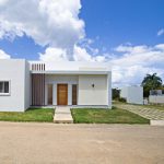 Buydrproperty Modern White Countryside Villa for Sale with Wooden Door and Accents Villas Tisú Sosua Real Estate Buydrpropertycom Buydrpropertycom