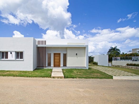 buyDRproperty Modern white Countryside Villa For Sale with wooden door and accents, Villas Tisú Sosua Real Estate