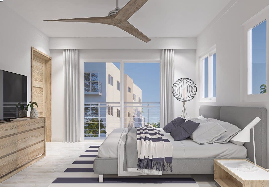 buyDRproperty Modern bedroom with a gray bed, striped rug, and balcony view. Condo for sale close to beach. Sosua Real Estate