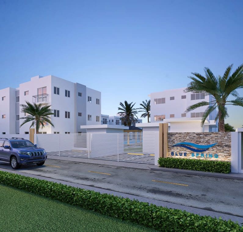 buyDRproperty Blue Springs condo complex entrance with "Blue Springs" sign. Near the beach. Sosua Real Estate