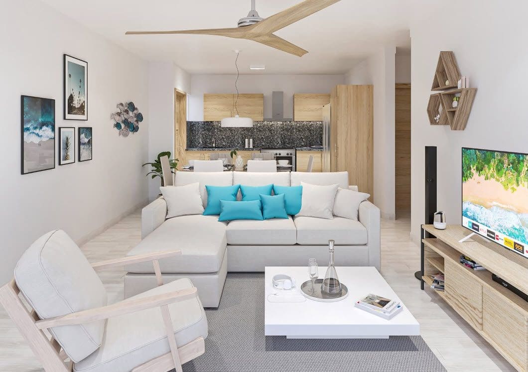 buyDRproperty Modern living room with a white sectional sofa, close to the beach. Condo For Sale. Sosua Real Estate