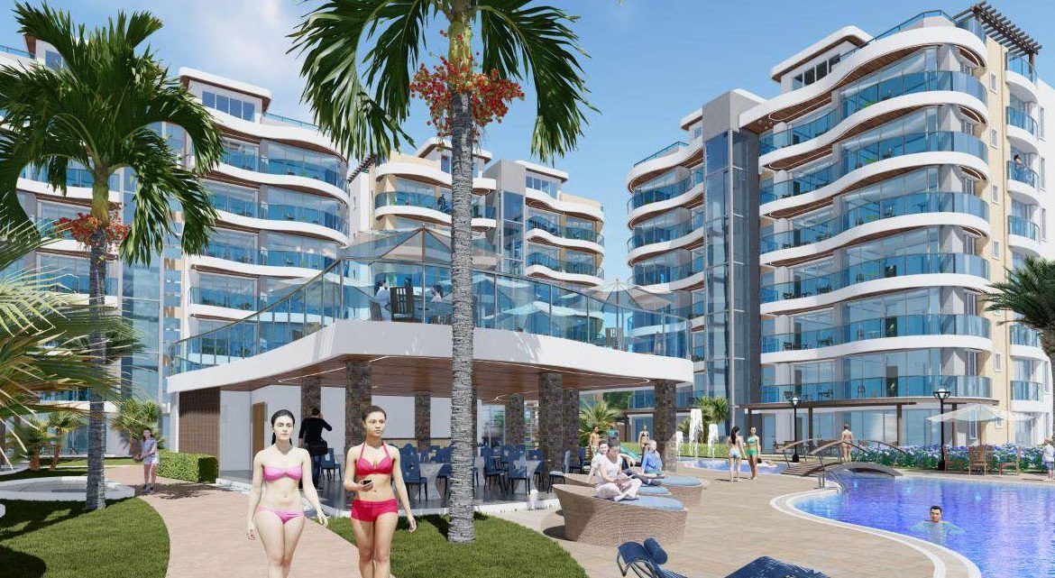 buyDRproperty Luxury condos at Atlantic Luxury Towers in the Dominican Republic, with pool and palm trees. Sosua Real Estate