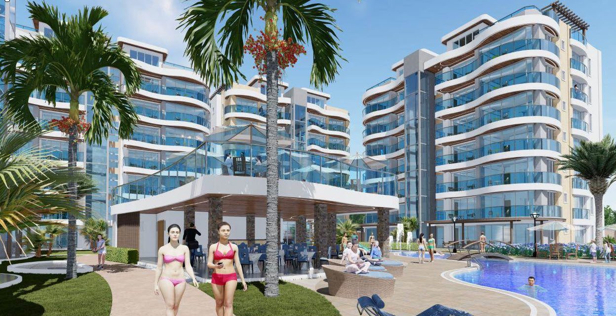 buyDRproperty Luxury condos at Atlantic Luxury Towers in the Dominican Republic, with pool and palm trees. Sosua Real Estate