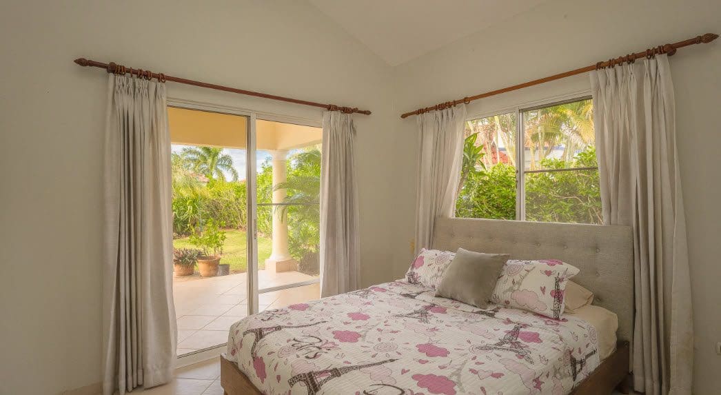 buyDRproperty Bedroom in a beautiful 3 bedroom villa with garden view and light curtains. Sosua Real Estate