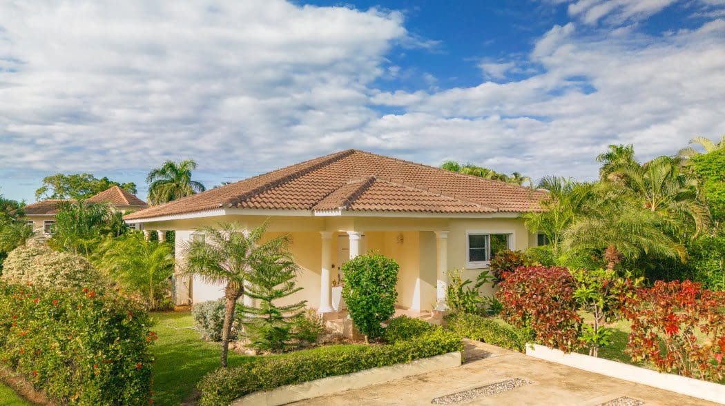 buyDRproperty Beautiful 3 Bedroom Villa with lush landscaping and a tiled roof Sosua Real Estate