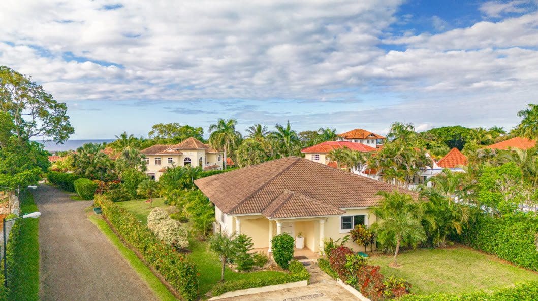 buyDRproperty Beautiful 3 Bedroom Villa in Hispaniola with lush landscaping and tile roof. Sosua Real Estate