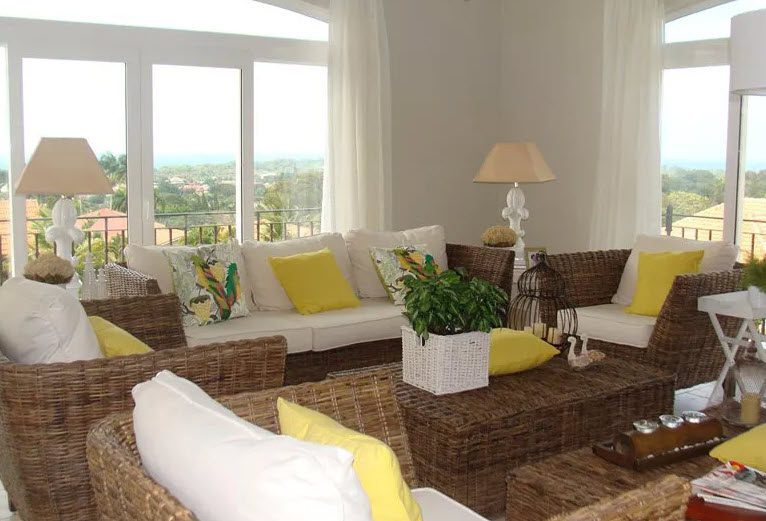 buyDRproperty Living room in a Beautiful 5 Bedroom Villa with wicker furniture and views of Residential Hispaniola. Sosua Real Estate
