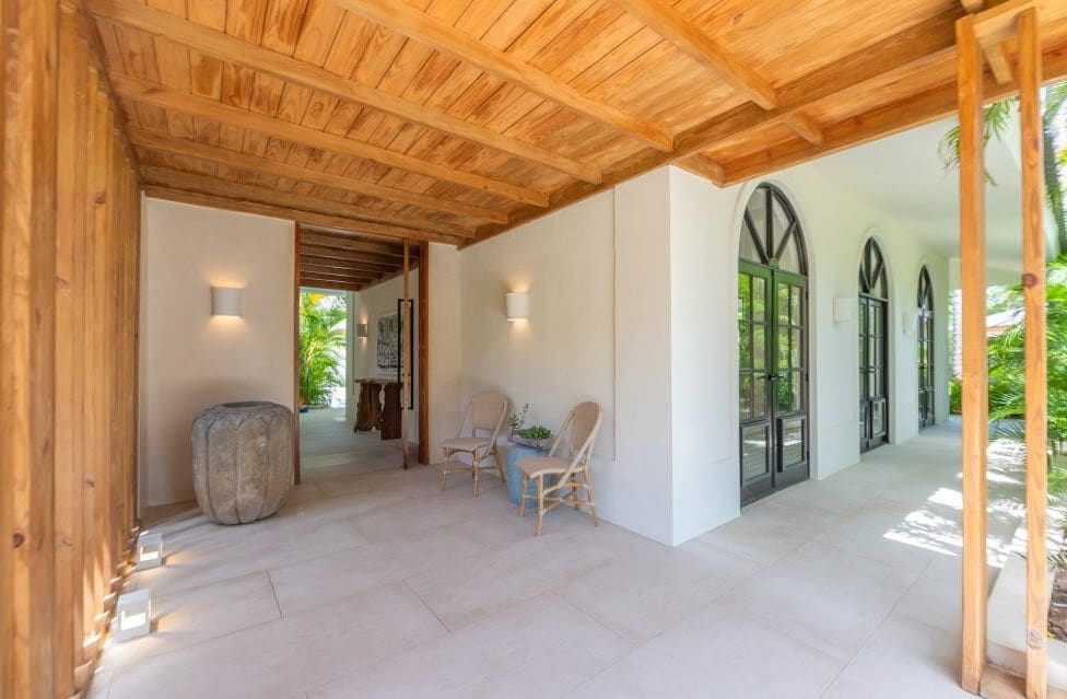 buyDRproperty Stunning Villa SUNSET entrance with wood ceiling and arched doors Sosua Real Estate