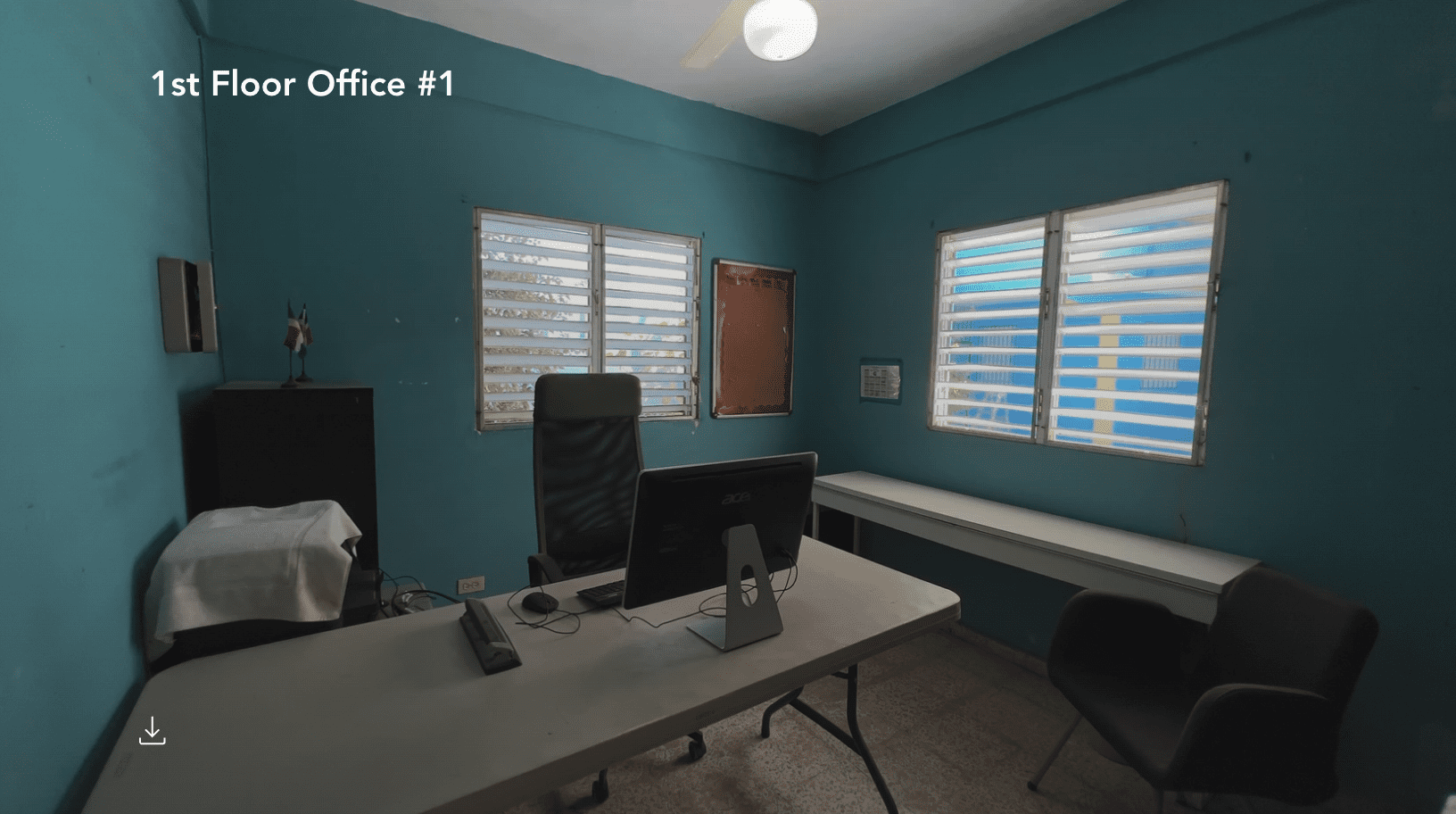 buyDRproperty Office space for a hostel business with windows and a desk. Sosua Real Estate