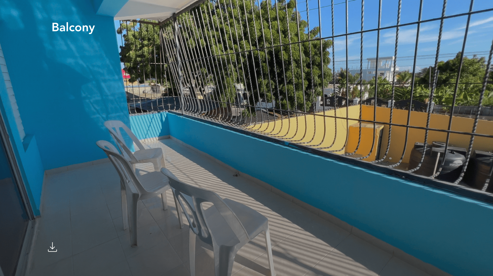 buyDRproperty Balcony of a hostel business in Monti Cristi with white chairs and a view. Sosua Real Estate