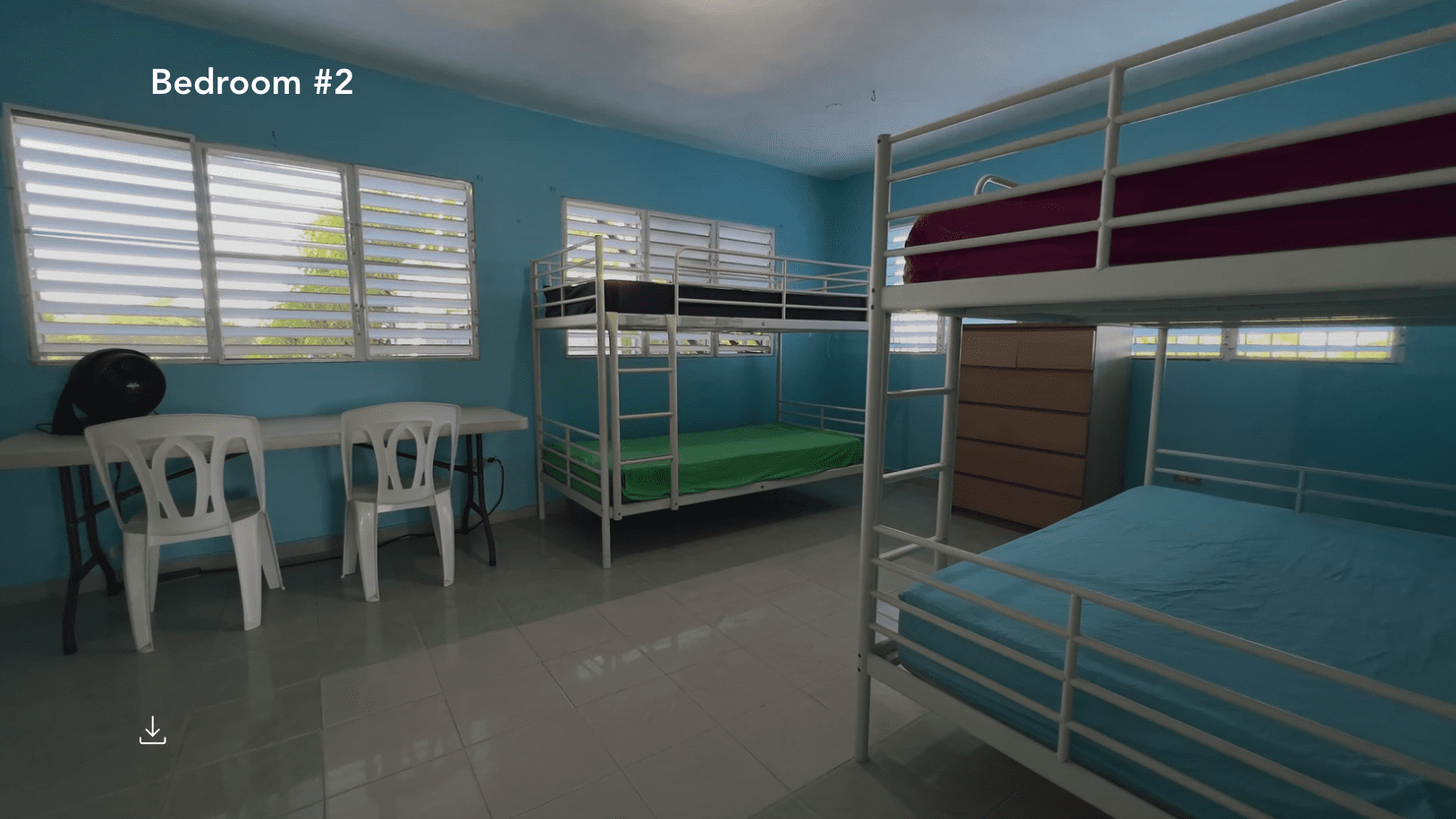 buyDRproperty Bedroom #2 at a hostel business with bunk beds and windows. Sosua Real Estate